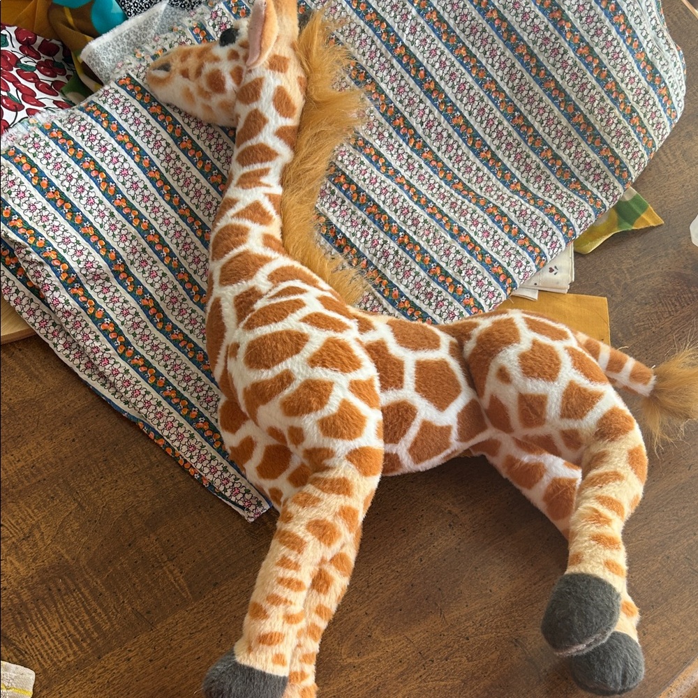 Giraffe model Linzy brand stuffed animal.